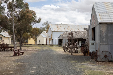 gravel street with old buildings